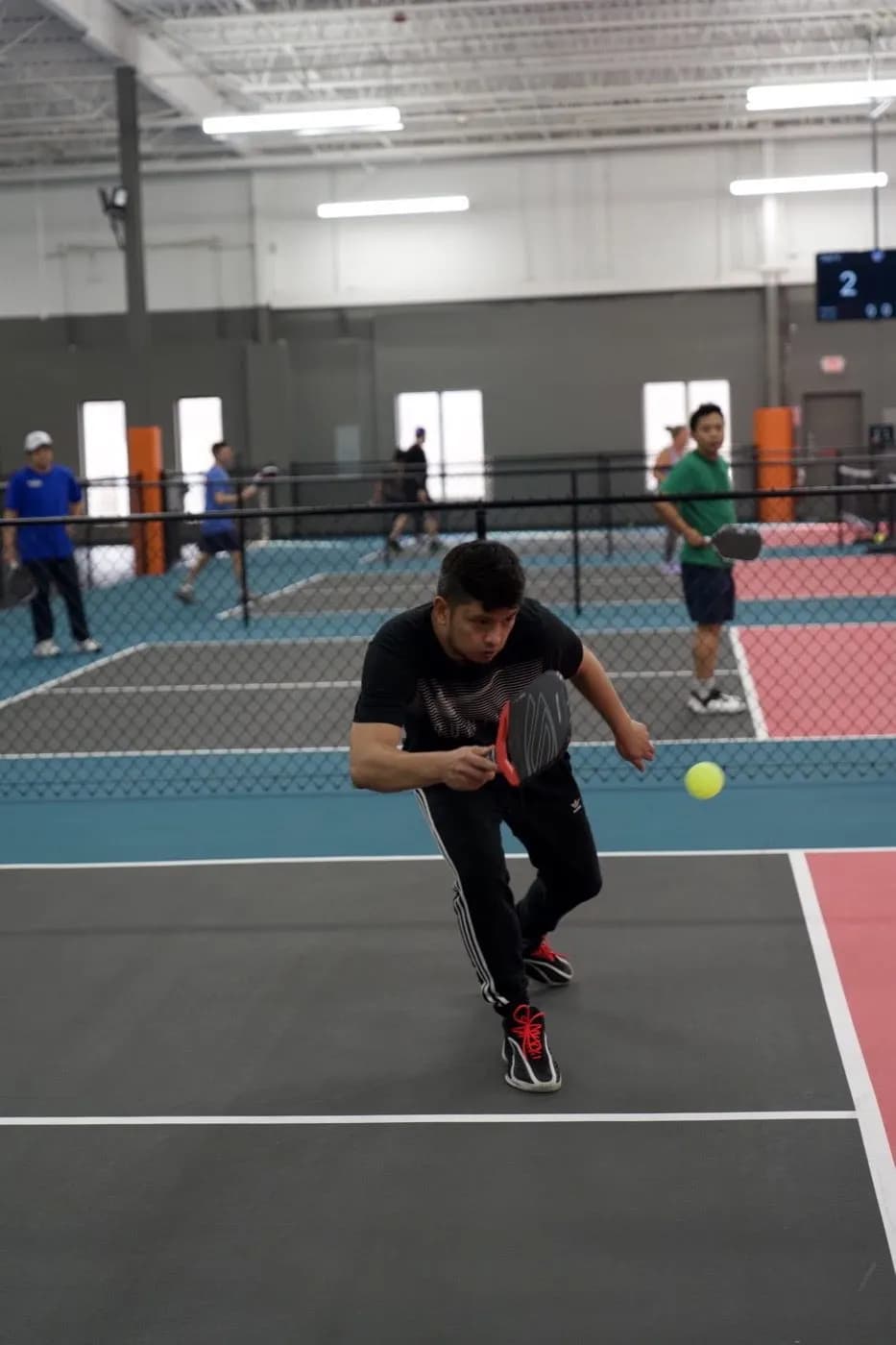 Player charging the net for a volley
