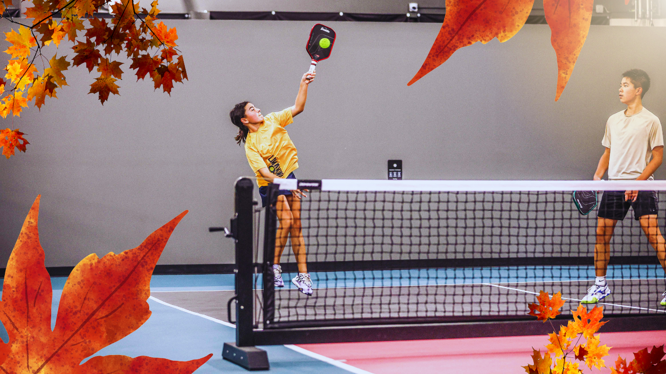 Fall Frenzy Tournament promotional banner with autumn leaves, showing a player serving on an indoor pickleball court